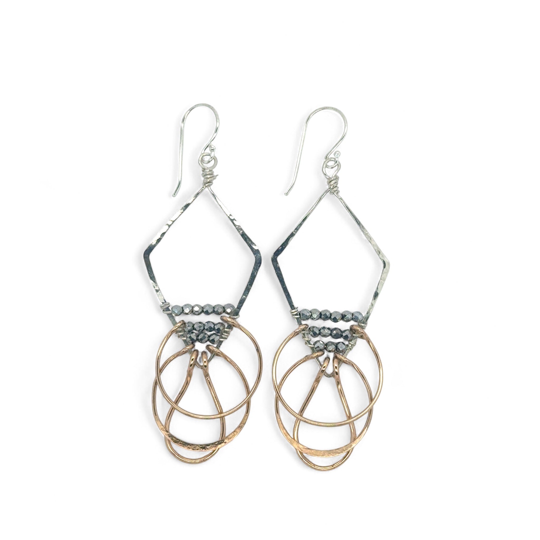 Sterling silver handmade diamond earrings with three bronze rings hanging from the bottom accented with silver pyrite gemstones