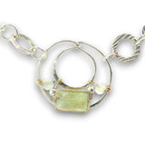 Sterling silver channel hoop pendant with green kyanite, sterling silver beds, and prehnite gemstones, featuring a textured sterling chain and delicate chain necklace