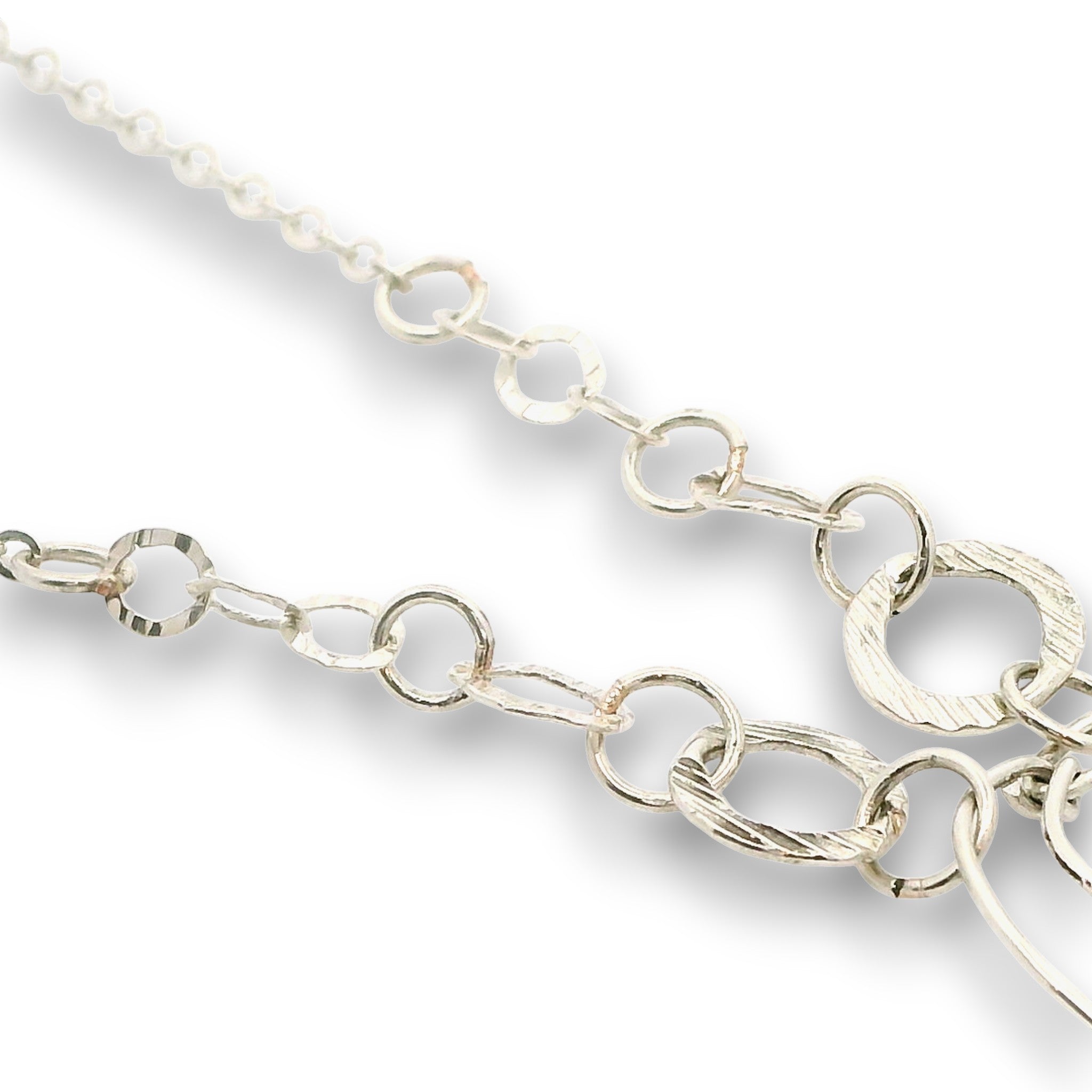 Sterling silver channel hoop pendant with green kyanite, sterling silver beds, and prehnite gemstones, featuring a textured sterling chain and delicate chain necklace