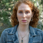 Smooth kyanite accented with crystal cubes and blue tourmaline gemstones inside a brass rectangle hanging from handmade hammered brass rectangle link necklace