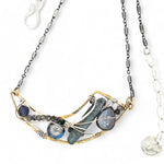 Brass crescent necklace on oxidized sterling silver tube chain with blue kyanite slice, mauve moonstone drop, crystal, iolite, and tourmalinated quartz gemstones on sterling silver wire necklace