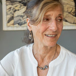 Brass crescent necklace on oxidized sterling silver tube chain with blue kyanite slice, mauve moonstone drop, crystal, iolite, and tourmalinated quartz gemstones on sterling silver wire necklace