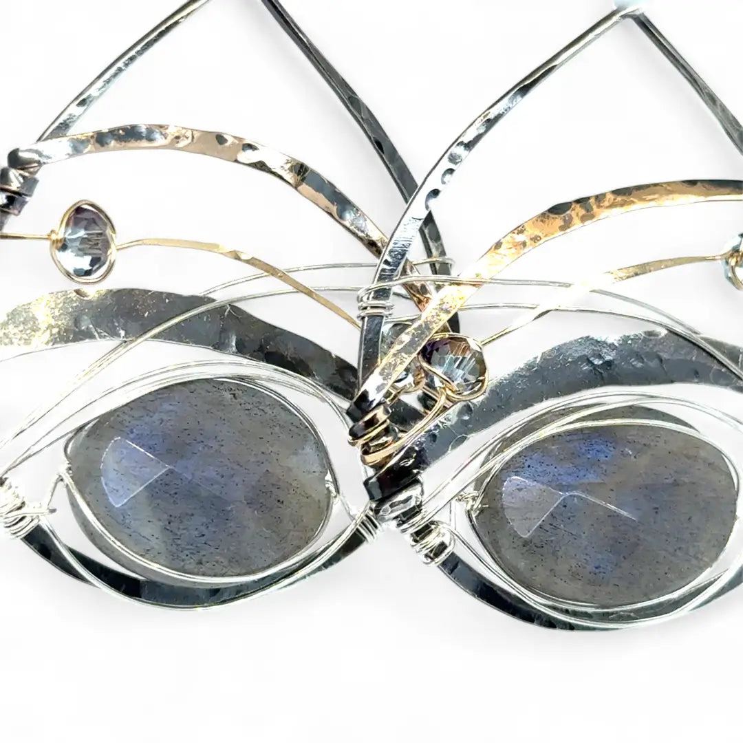 darkened sterling silver fat drop earrings with brass, gold fill and blue crystal accents featuring a prominent flashy labradorite gemstone