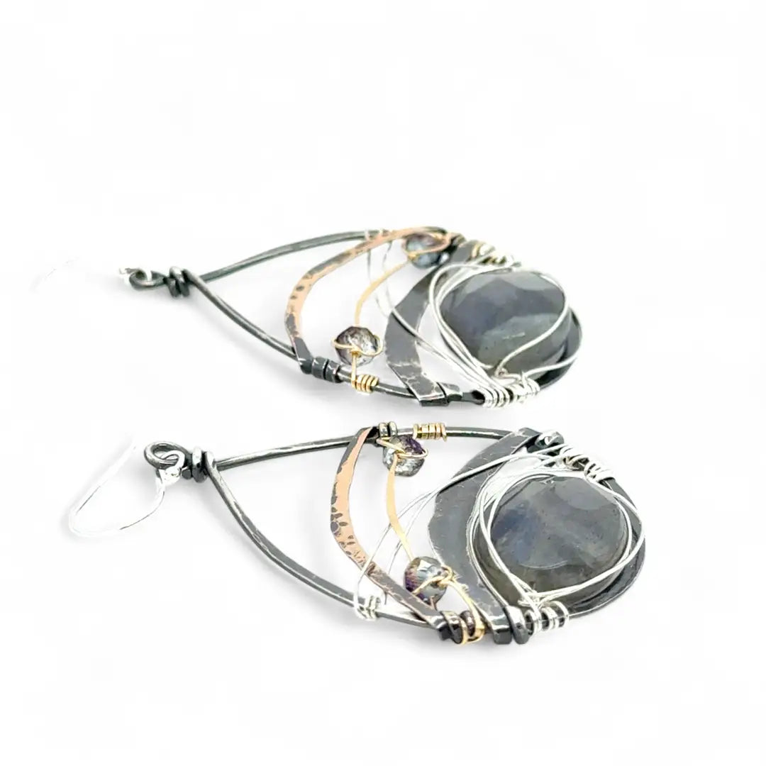 darkened sterling silver fat drop earrings with brass, gold fill and blue crystal accents featuring a prominent flashy labradorite gemstone