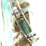 A stackable Labradorite and moonstone gemstone sterling silver skinny bracelet with twisted sterling silver and hammered bronze details