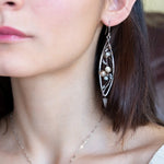 Long skinny sterling silver darkened marquise earrings embroidered with mother of pearl, fresh water pearl, and crystal gemstones on sterling silver and gold filled wire