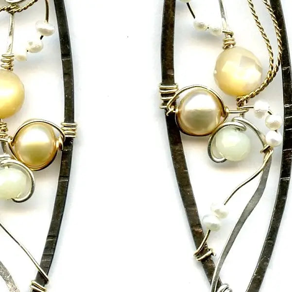 Long skinny sterling silver darkened marquise earrings embroidered with mother of pearl, fresh water pearl, and crystal gemstones on sterling silver and gold filled wire