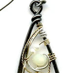 Long skinny sterling silver darkened marquise earrings embroidered with mother of pearl, fresh water pearl, and crystal gemstones on sterling silver and gold filled wire