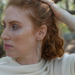 Long skinny sterling silver darkened marquise earrings embroidered with mother of pearl, fresh water pearl, and crystal gemstones on sterling silver and gold filled wire