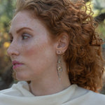 Long skinny sterling silver darkened marquise earrings embroidered with mother of pearl, fresh water pearl, and crystal gemstones on sterling silver and gold filled wire