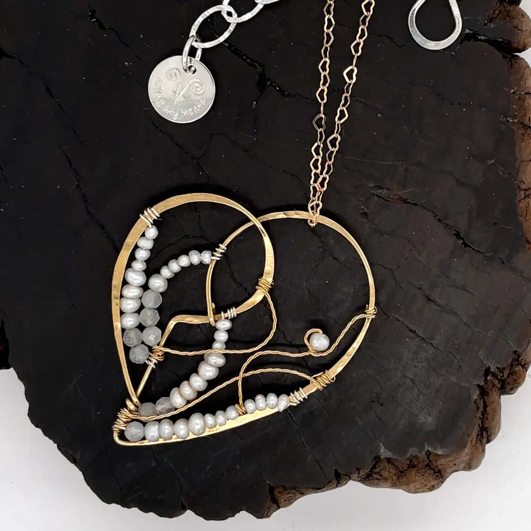 Brass heart necklace embroidered with tiny fresh water pearl and moonstone gemstones and brass twist accents on a delicate heart shaped gold filled chain