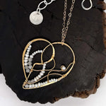 Brass heart necklace embroidered with tiny fresh water pearl and moonstone gemstones and brass twist accents on a delicate heart shaped gold filled chain