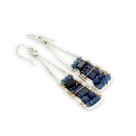 Lapis and onyx gemstones stacked with blue crystal on gold filled wire within a skinny, tall sterling silver triangle shaped earrings