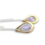 Lavender cubic zirconia drop gemstones sit inside tiny brass hammered teardrops on a long sterling silver earring hook