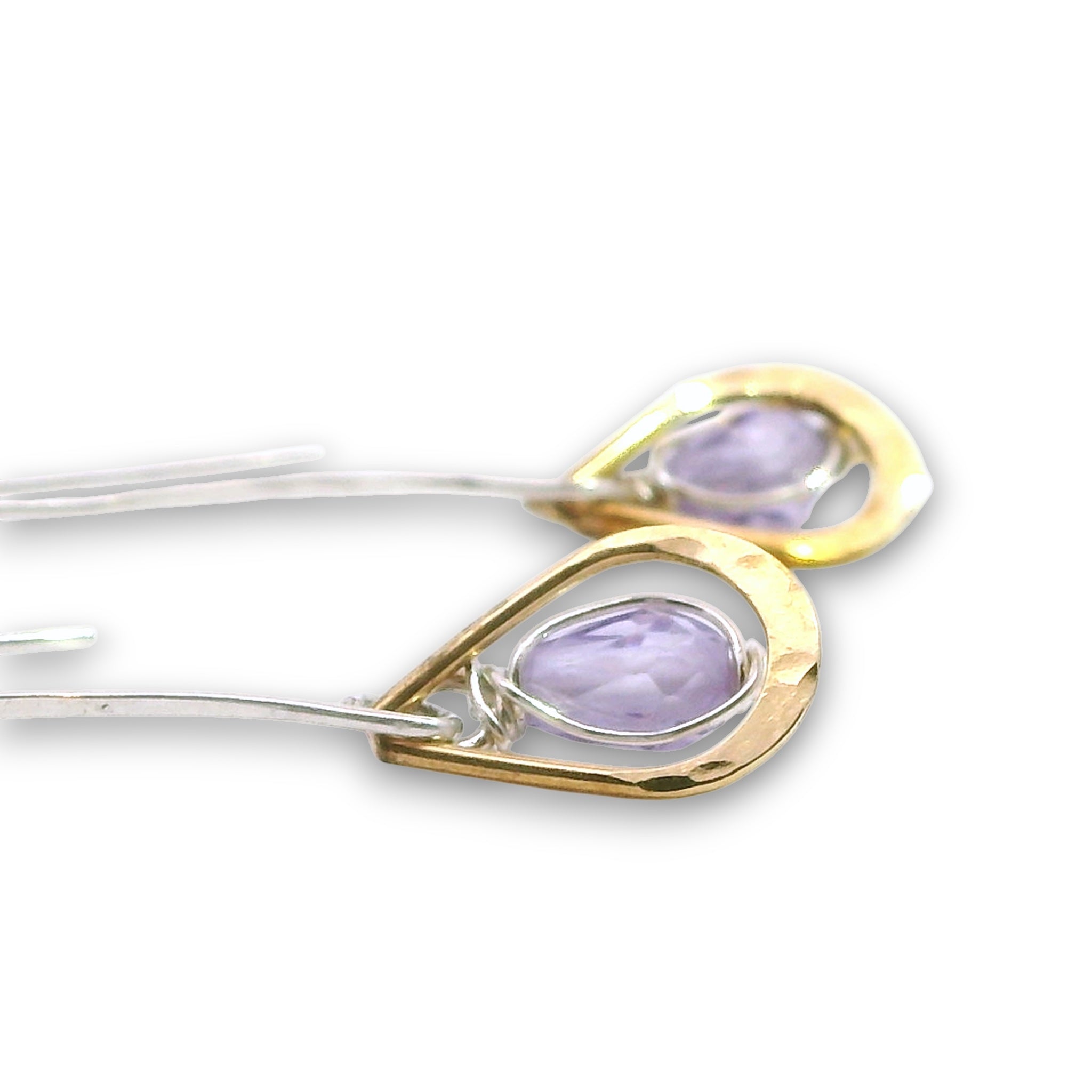 Lavender cubic zirconia drop gemstones sit inside tiny brass hammered teardrops on a long sterling silver earring hook