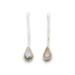 Lavender cubic zirconia drop gemstones sit inside tiny brass hammered teardrops on a long sterling silver earring hook