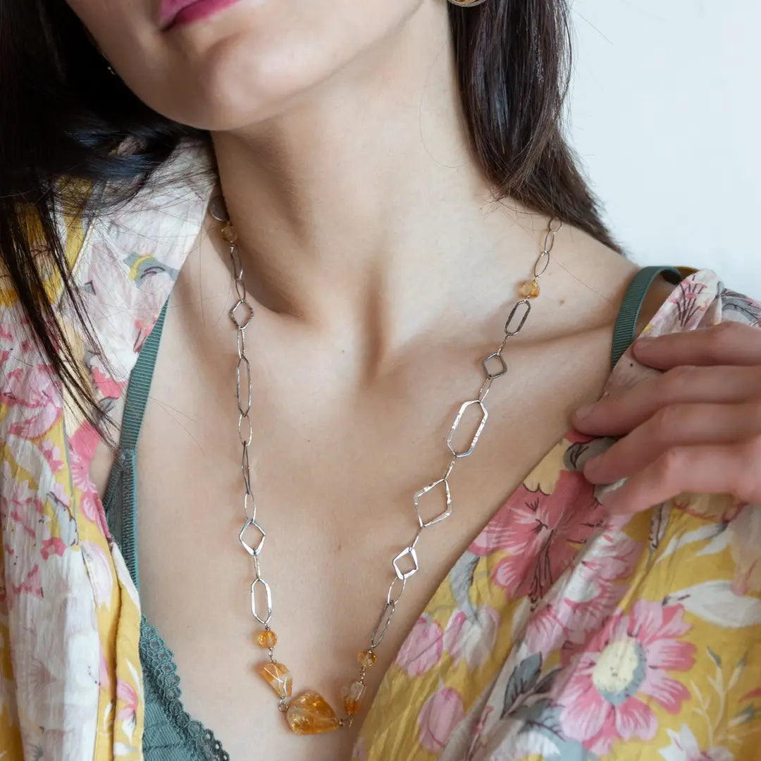 Citrine gemstone nuggets and handmade hammered geometric links are interspersed with sparkly sterling silver links to form this long chain necklace