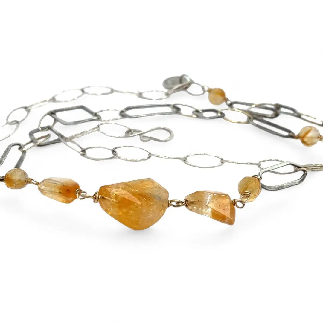 Citrine gemstone nuggets and handmade hammered geometric links are interspersed with sparkly sterling silver links to form this long chain necklace