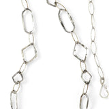 Citrine gemstone nuggets and handmade hammered geometric links are interspersed with sparkly sterling silver links to form this long chain necklace