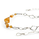 Citrine gemstone nuggets and handmade hammered geometric links are interspersed with sparkly sterling silver links to form this long chain necklace