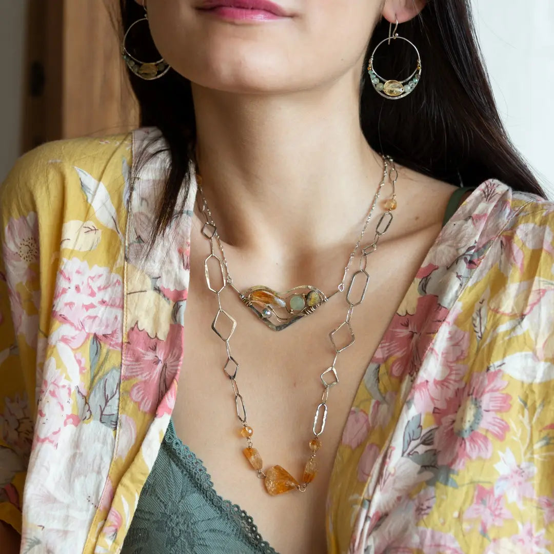 Citrine gemstone nuggets and handmade hammered geometric links are interspersed with sparkly sterling silver links to form this long chain necklace