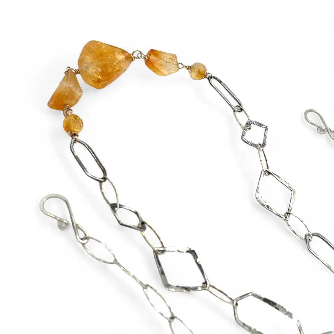 Citrine gemstone nuggets and handmade hammered geometric links are interspersed with sparkly sterling silver links to form this long chain necklace