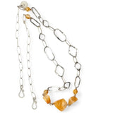 Citrine gemstone nuggets and handmade hammered geometric links are interspersed with sparkly sterling silver links to form this long chain necklace