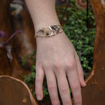 Bloodstone and labradorite faceted gemstones held within a sterling silver hand formed wave bracelet with oxidized sterling twist, gold filled wire and brass accents