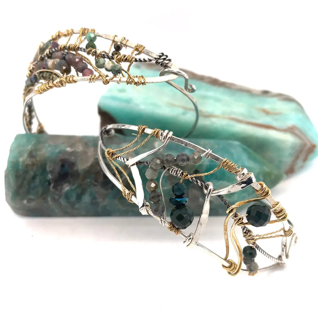 Bloodstone and labradorite faceted gemstones held within a sterling silver hand formed wave bracelet with oxidized sterling twist, gold filled wire and brass accents