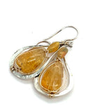 Smooth citrine nuggets are wrapped in gold filled wire inside a sterling silver handmade drop earring with opal accent