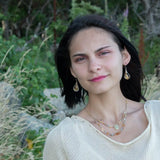 Smooth citrine nuggets are wrapped in gold filled wire inside a sterling silver handmade drop earring with opal accent