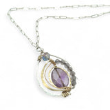 Teardrop-shaped sterling silver and brass pendatn with amethyst, labradorite, and crystal gemstones on delicate sterling silver chain