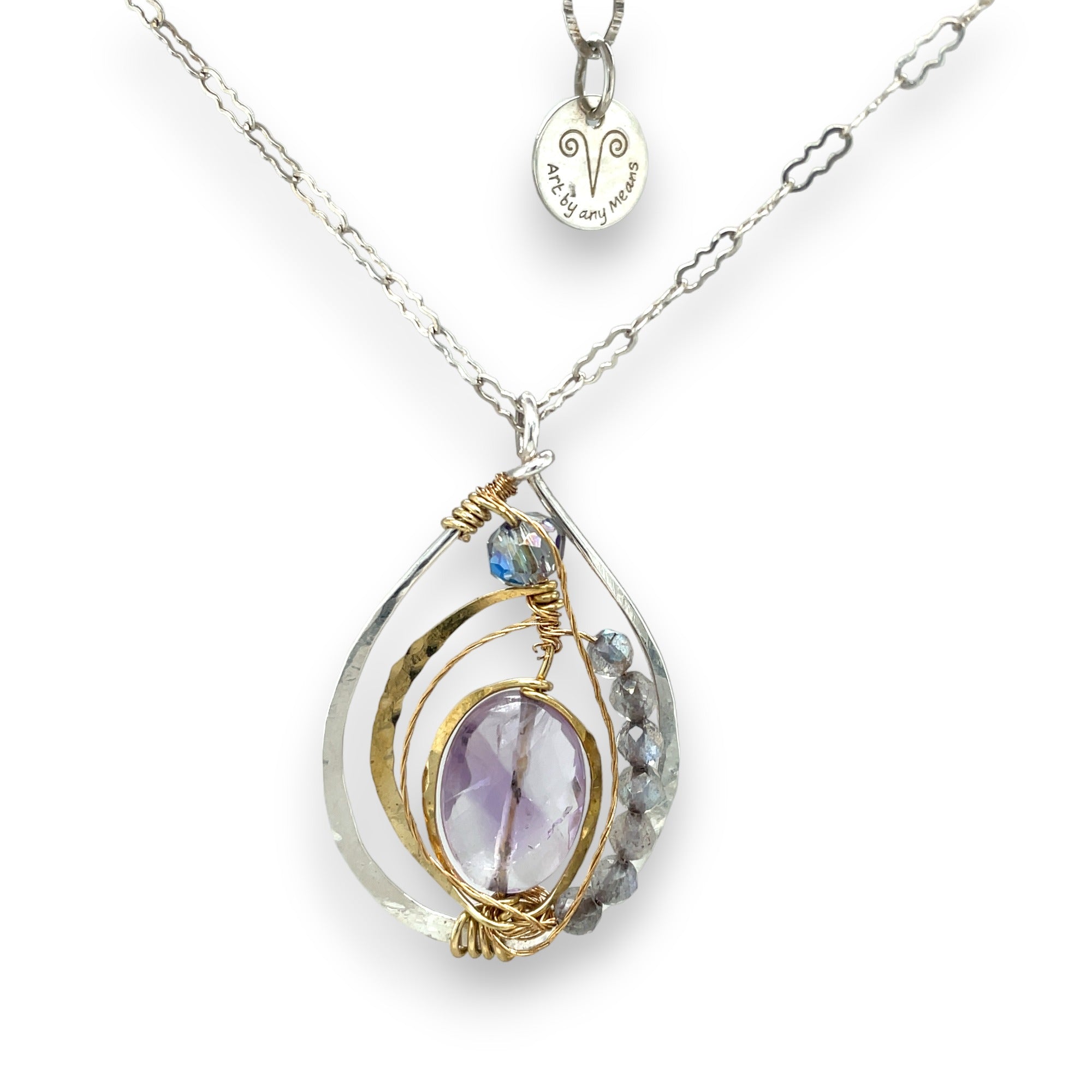Teardrop-shaped sterling silver and brass pendatn with amethyst, labradorite, and crystal gemstones on delicate sterling silver chain