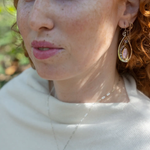 Teardrop-shaped sterling silver and brass earrings with amethyst, labradorite, and crystal gemstones 