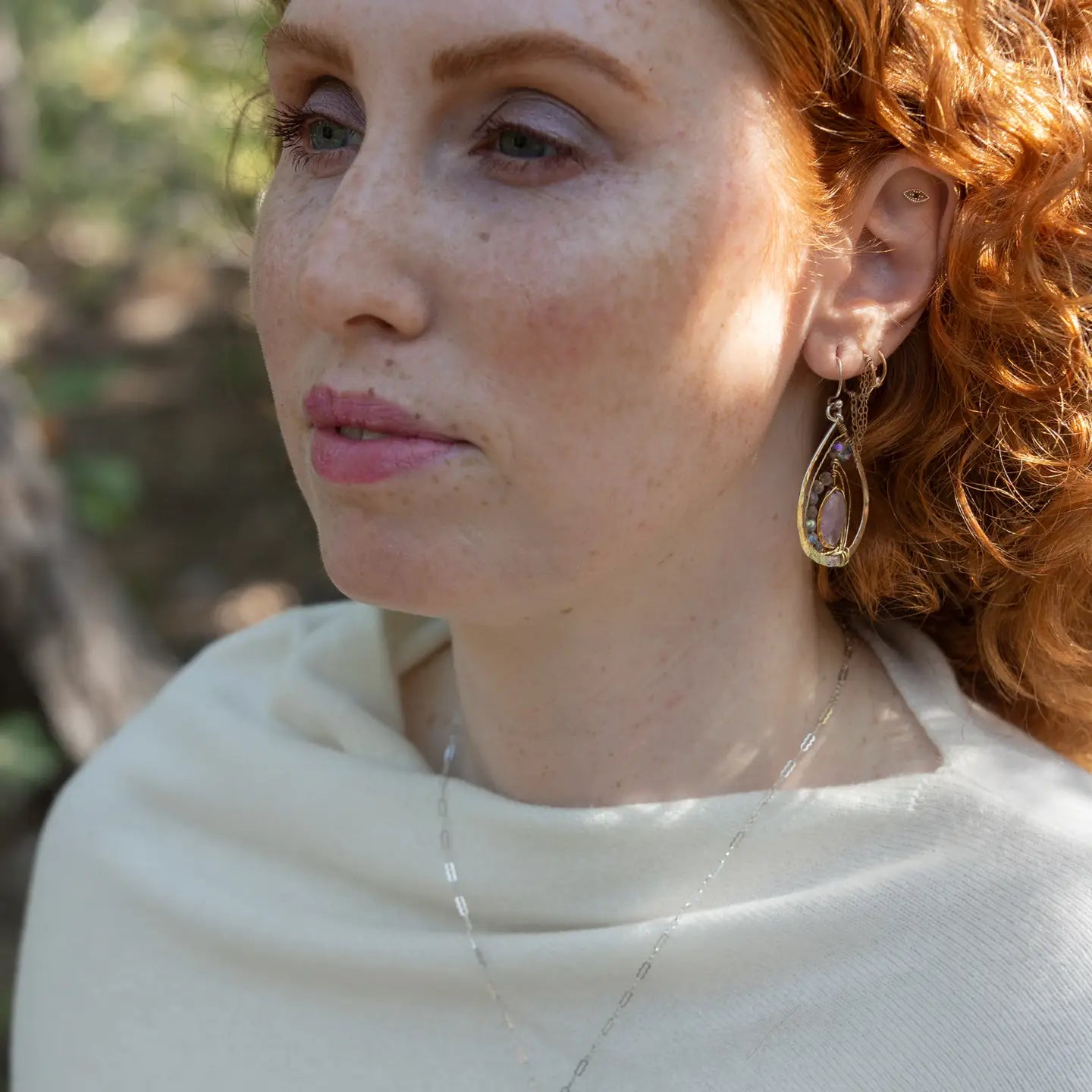 Teardrop-shaped sterling silver and brass earrings with amethyst, labradorite, and crystal gemstones 