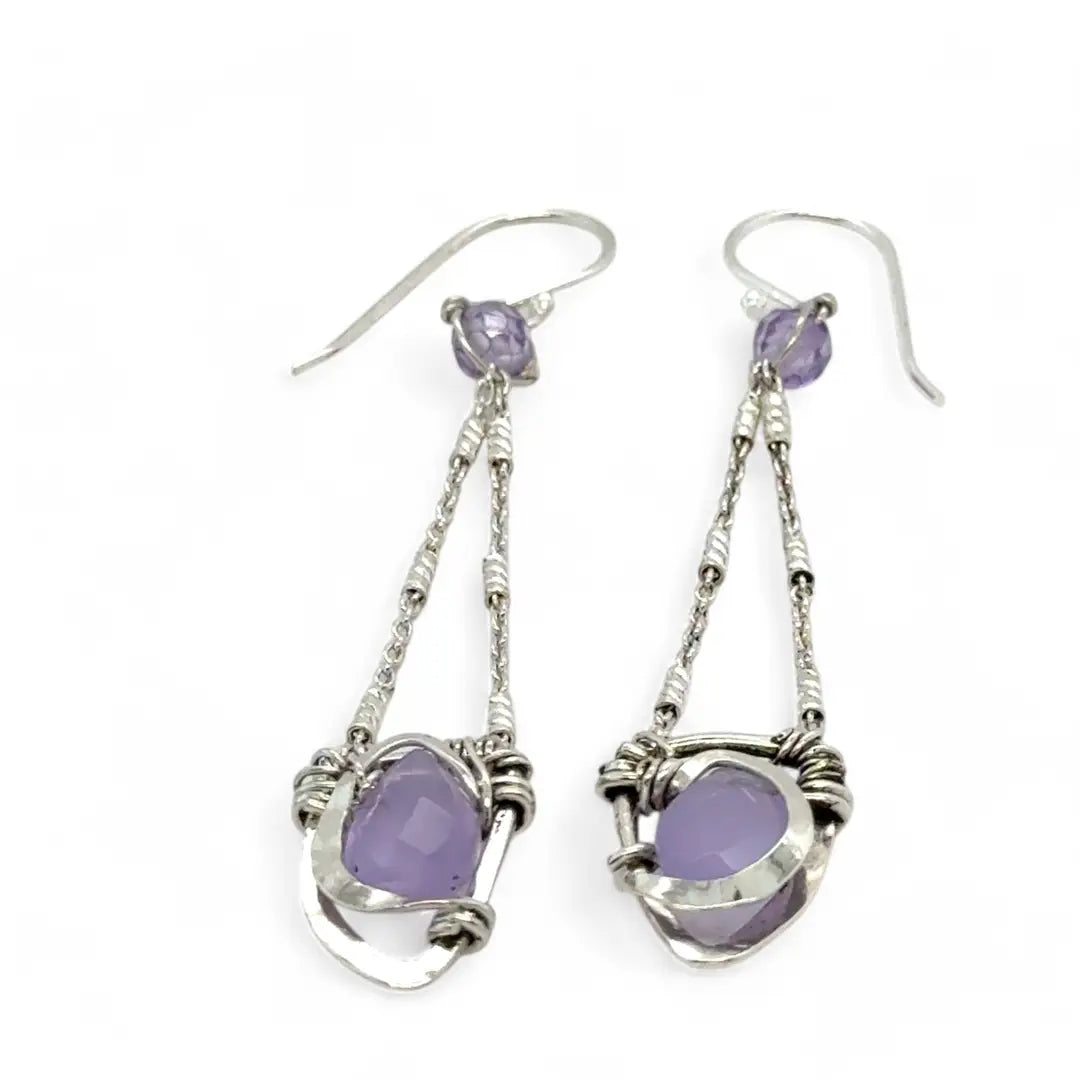 A pair of sterling silver earrings featuring faceted tear drop lavender jade stones with sterling silver chains and a cubic zirconia closure