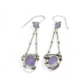 A pair of sterling silver earrings featuring faceted tear drop lavender jade stones with sterling silver chains and a cubic zirconia closure