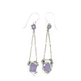 A pair of sterling silver earrings featuring faceted tear drop lavender jade stones with sterling silver chains and a cubic zirconia closure