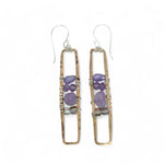 A pair of skinny tall bronze rectangle earrings with lilac purple amethyst pebbles, faceted amethyst gemstones, cubic zirconia purple drops, and crystal cubes stacked ontop of each other