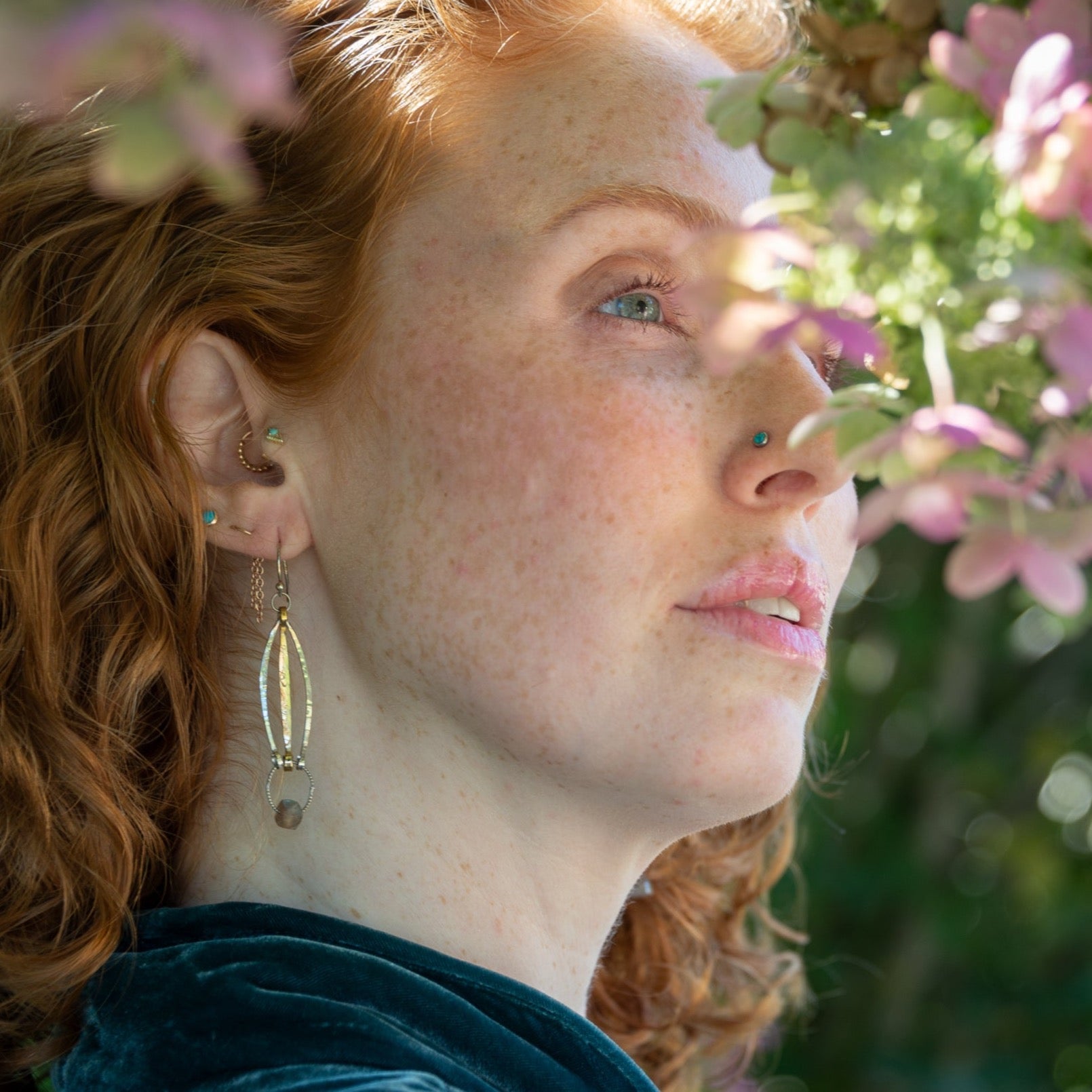 Stamped sterling silver and brass marquise earrings with a tiny, flashy labradorite cube hanging at the bottom
