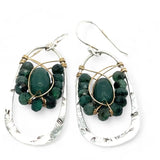A pair of sterling silver hoop leaf stamped earrings with gold-filled woven bands, jade, and faceted emerald gemstones.