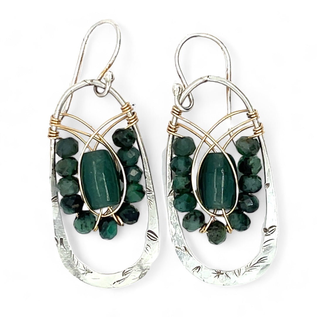 A pair of sterling silver hoop leaf stamped earrings with gold-filled woven bands, jade, and faceted emerald gemstones.
