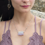 Raw edge amethyst slab held in waves of sterling silver and gold fill wires with a moonstone accent on delicate sterling silver chain with oxidized sparkly diamond cut link necklace