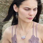 Raw edge amethyst slab held in waves of sterling silver and gold fill wires with a moonstone accent on delicate sterling silver chain with oxidized sparkly diamond cut link necklace