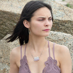 Raw edge amethyst slab held in waves of sterling silver and gold fill wires with a moonstone accent on delicate sterling silver chain with oxidized sparkly diamond cut link necklace