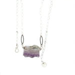 Raw edge amethyst slab held in waves of sterling silver and gold fill wires with a moonstone accent on delicate sterling silver chain with oxidized sparkly diamond cut link necklace