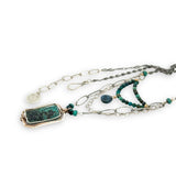 Turquoise rectangle wrapped in layers of hammered bronze and sterling silver wire pendant with another layer with chrysocolla and labradorite drop gemstones on oxidized sterling silver links and chain