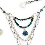 Turquoise rectangle wrapped in layers of hammered bronze and sterling silver wire pendant with another layer with chrysocolla and labradorite drop gemstones on oxidized sterling silver links and chain