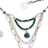 Turquoise rectangle wrapped in layers of hammered bronze and sterling silver wire pendant with another layer with chrysocolla and labradorite drop gemstones on oxidized sterling silver links and chain