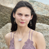 a pair of oxidized fern stamped arch earrings with sterling silver and bronze interlocked rings
